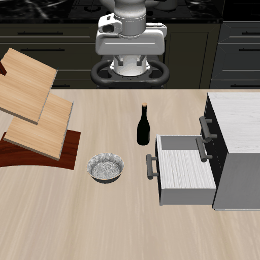 Put the black bowl in the bottom drawer of the cabinet and close it